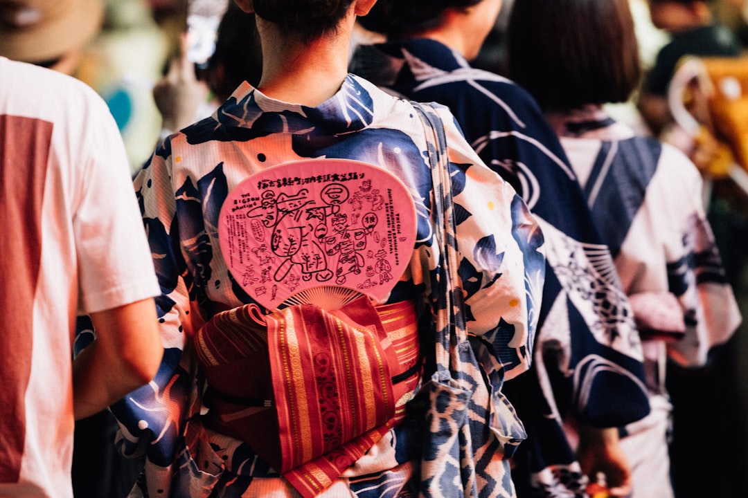 People in traditional japanese yukata with fans