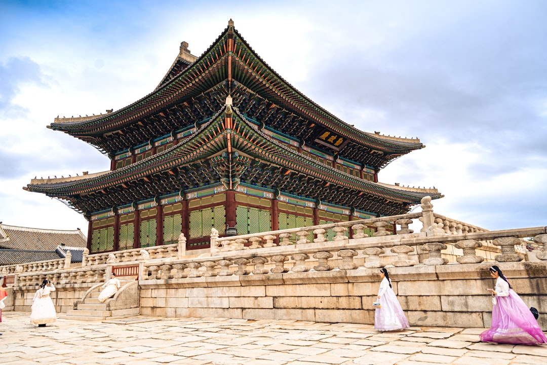 Traditional korean palace with women in hanbok