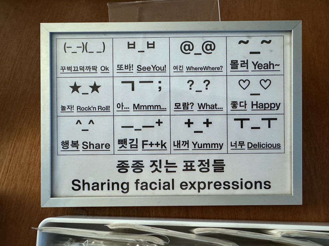 A sign that says sharing facial expressions in a foreign language
