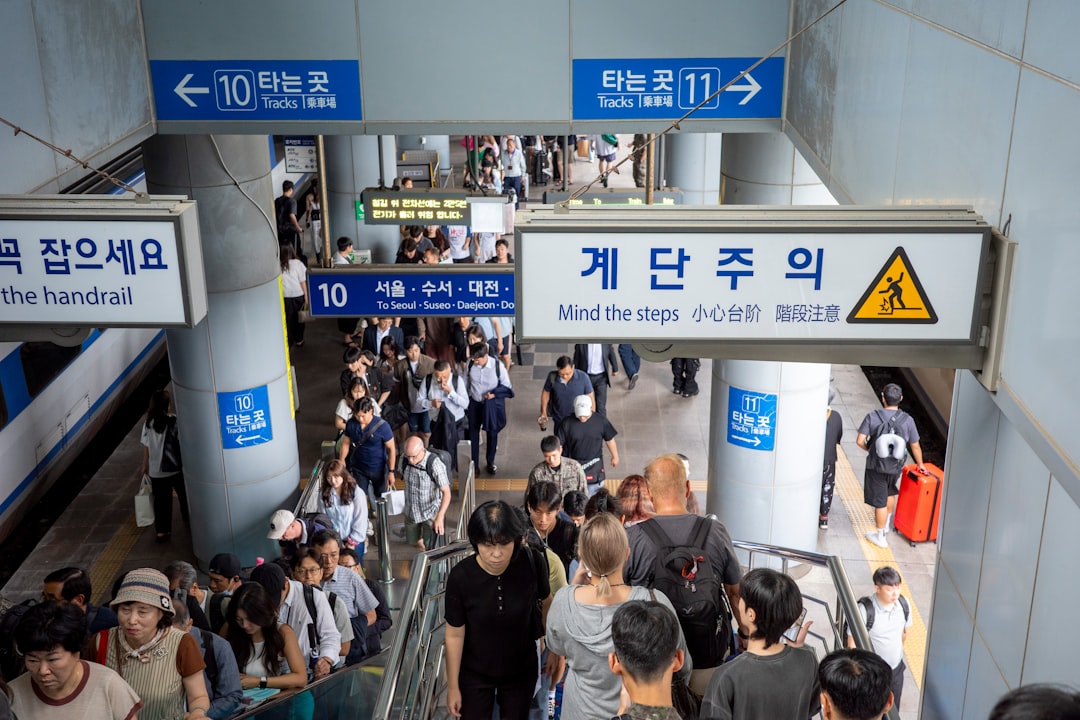People walk through a subway entrance in south korea.