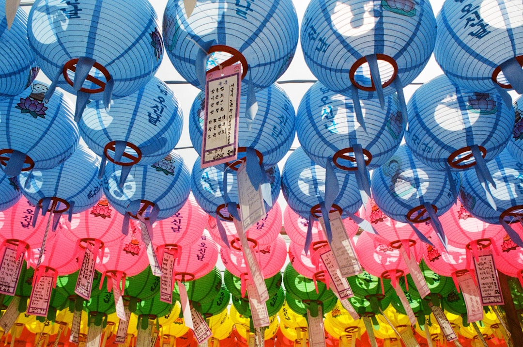 Rows of colorful paper lanterns hanging overhead.