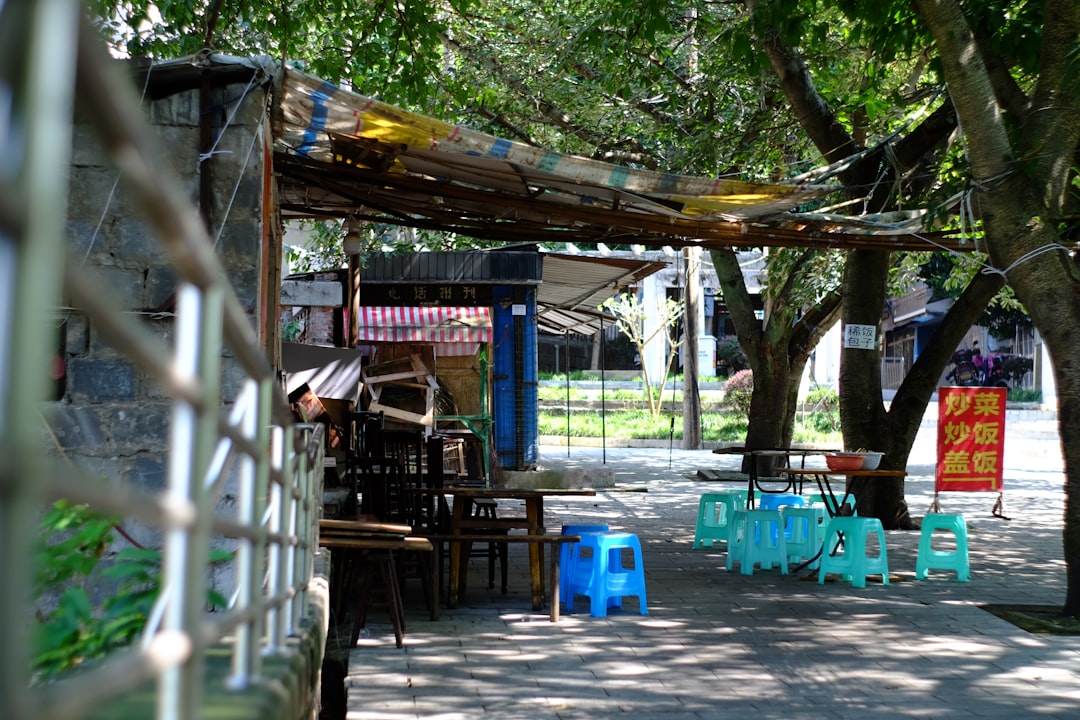 Outdoor seating area with tables and chairs