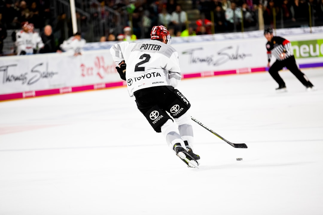 man playing ice hockey on the field