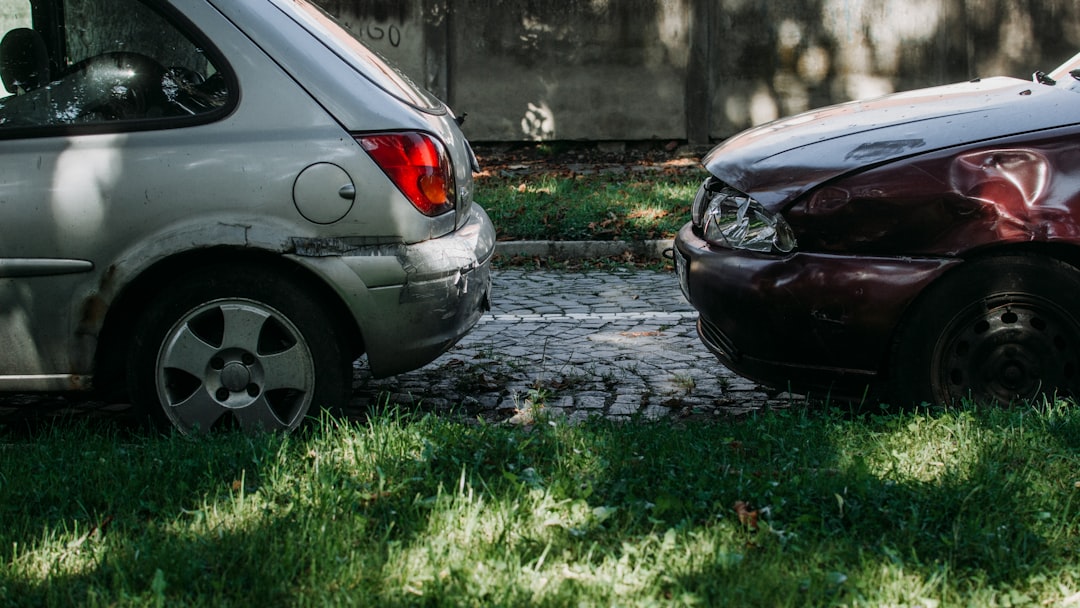 a couple of cars that are sitting in the grass