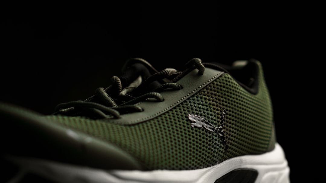 a close up of a green and white shoe