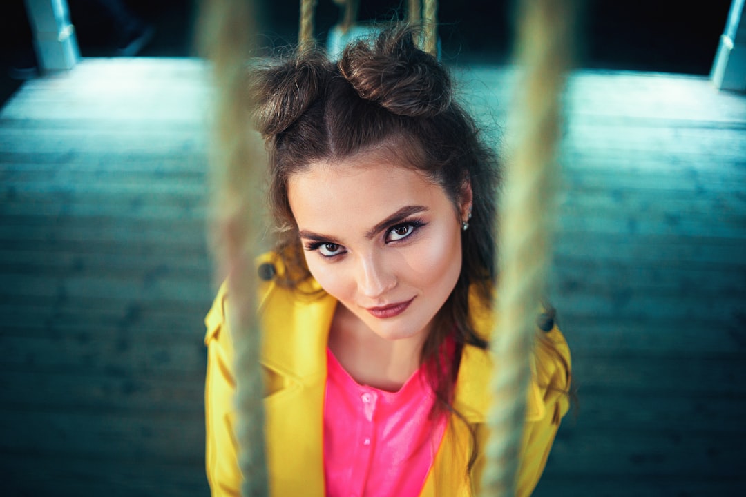 woman in yellow jacket smiling
