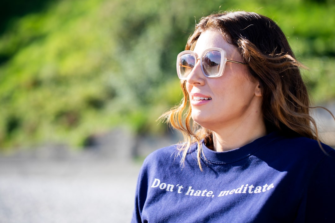 Woman wearing sunglasses and a sweatshirt