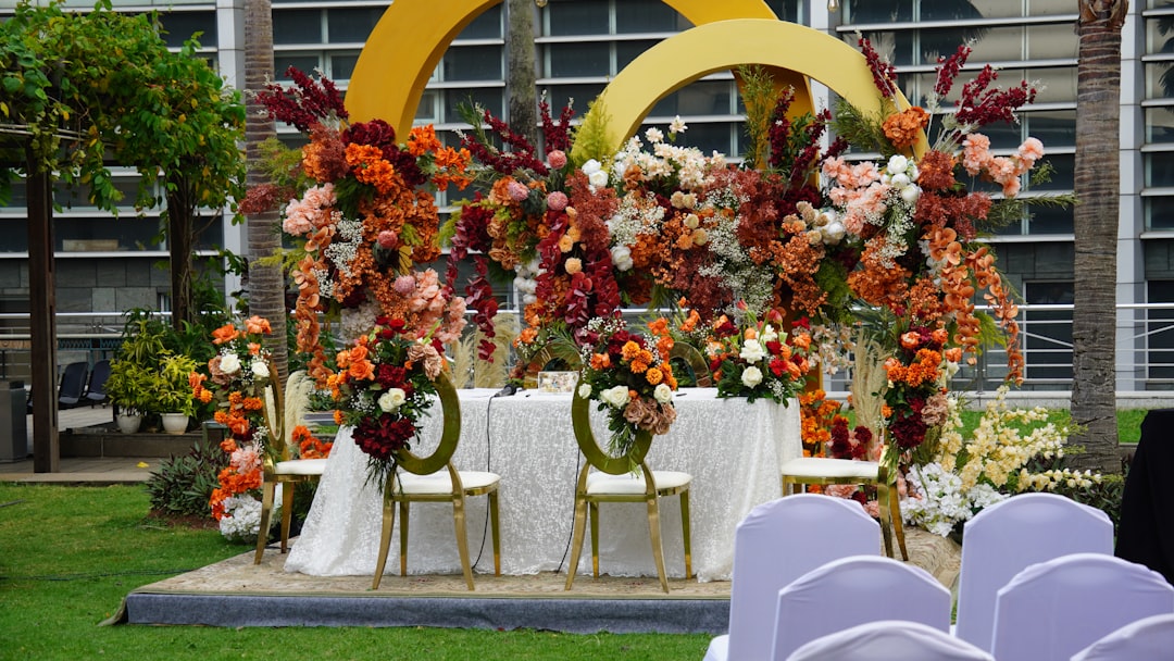 Wedding ceremony setup featuring floral arrangements.