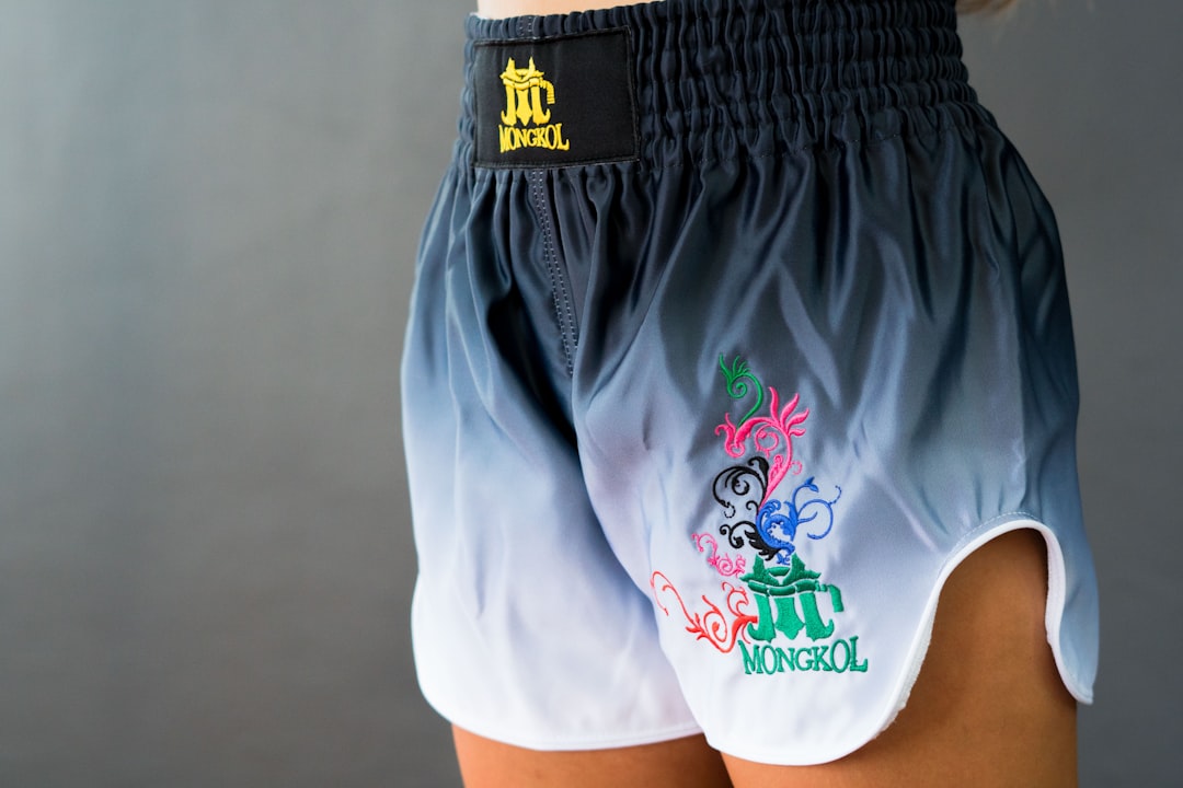 A woman wearing a pair of blue and white shorts