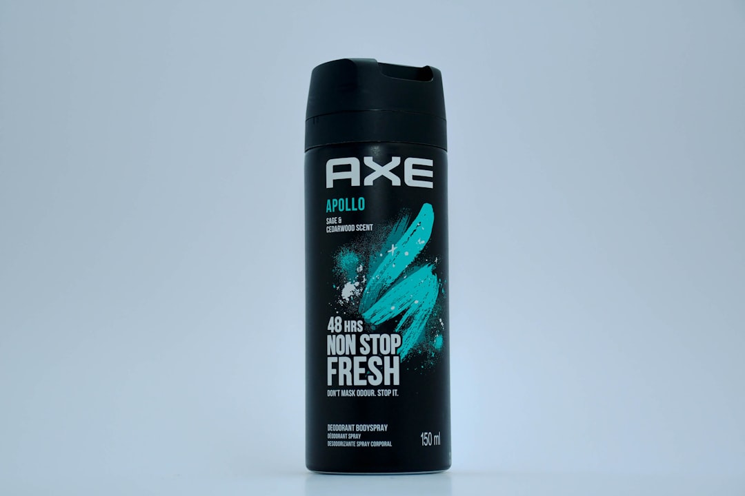 A bottle of axe men's fresh deodorant on a white background