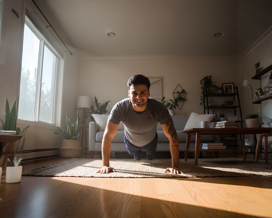 Man doing push-ups in a sunlit living room.