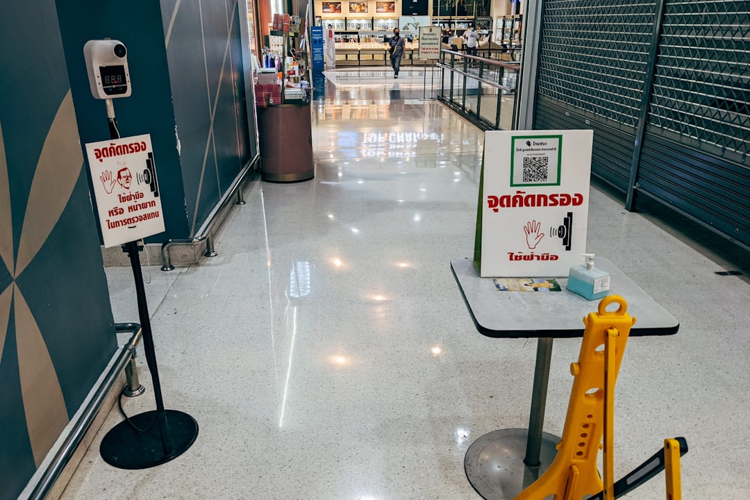 a sign on a table in a shopping mall