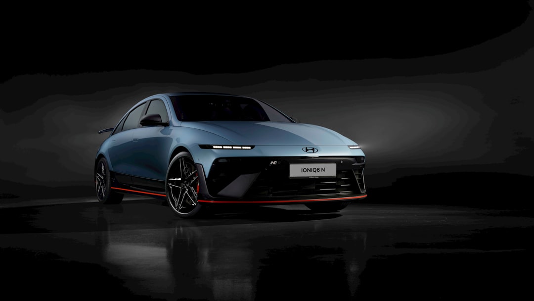 A sleek blue sports car with red accents.