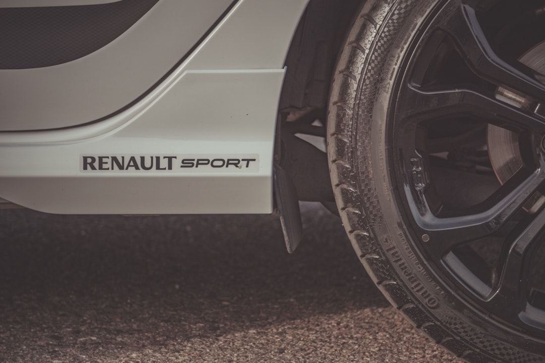 white and black car on road