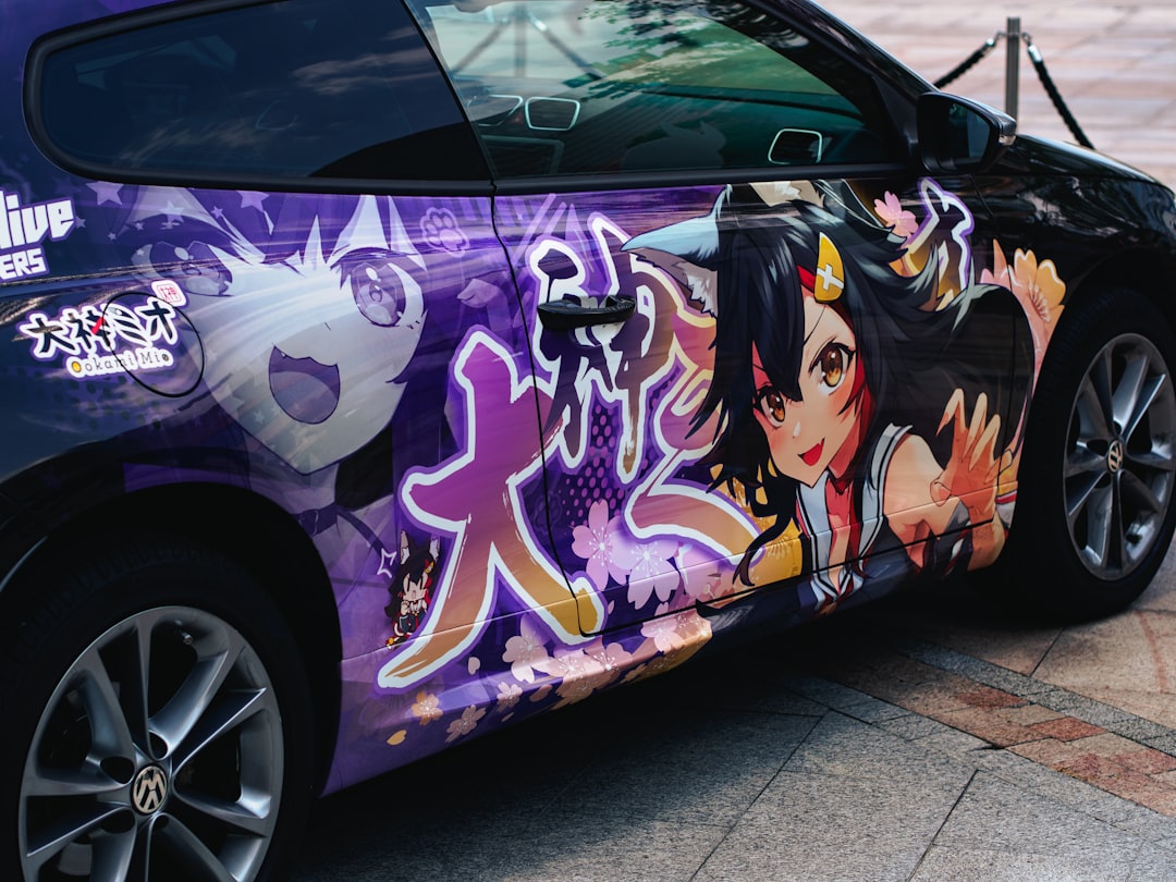 A car that has been painted with anime characters