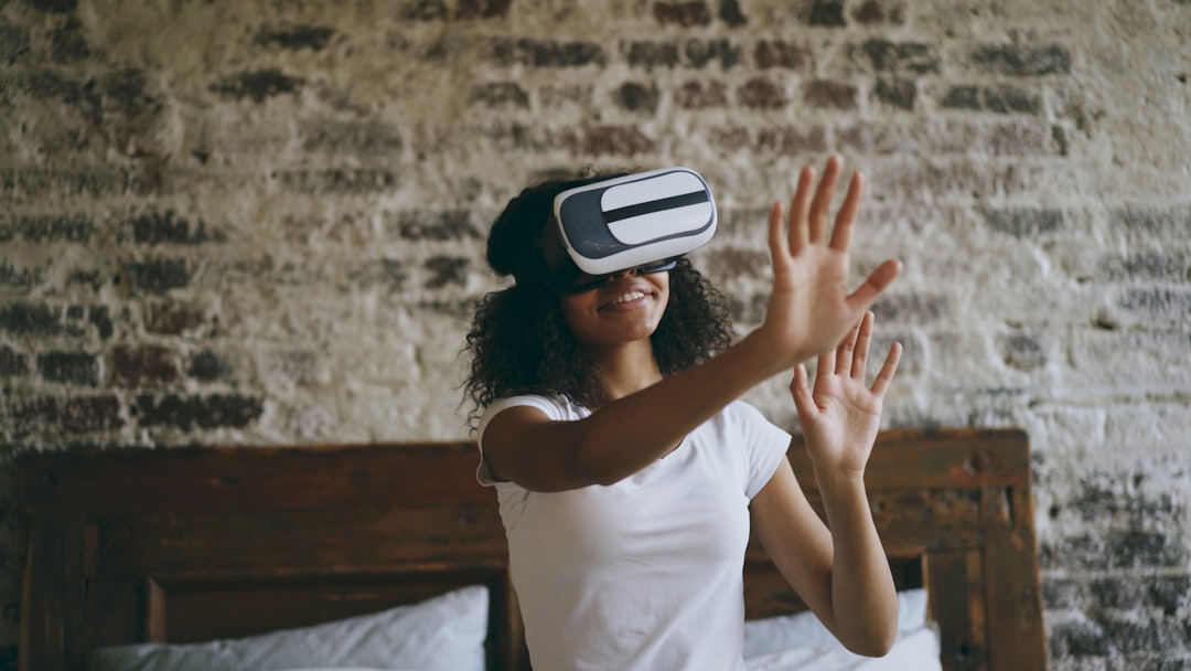 Young woman wearing vr headset, reaching out hands.