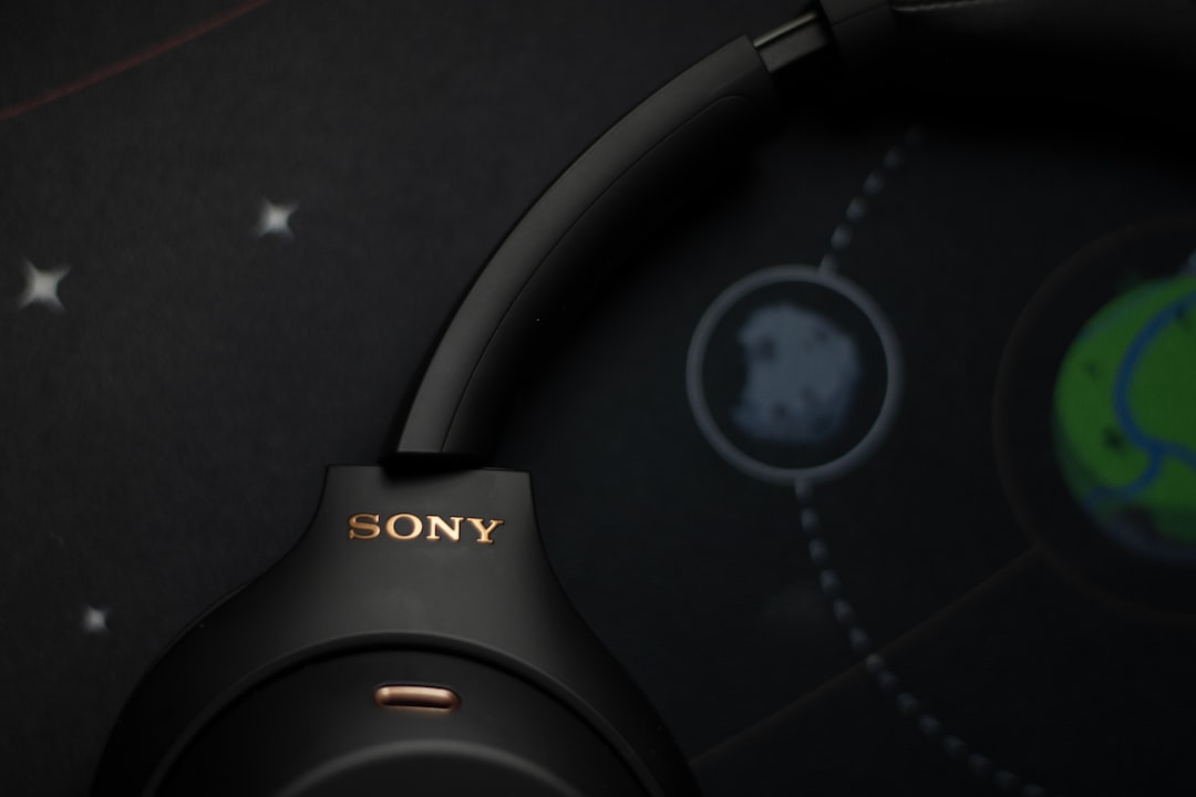 Black sony headphones on a starry background