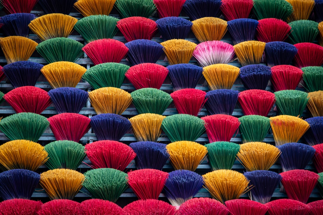 A bunch of colorful brushes sitting on top of each other