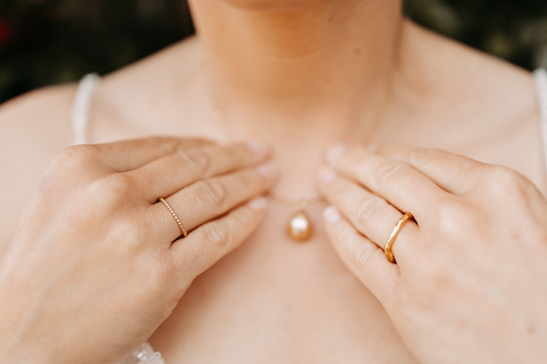 A woman wearing a ring around her neck