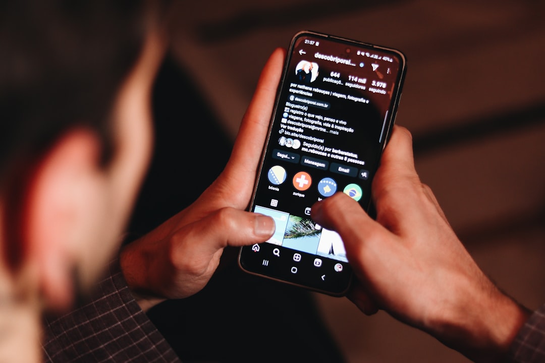 A man holding a cell phone up to his face
