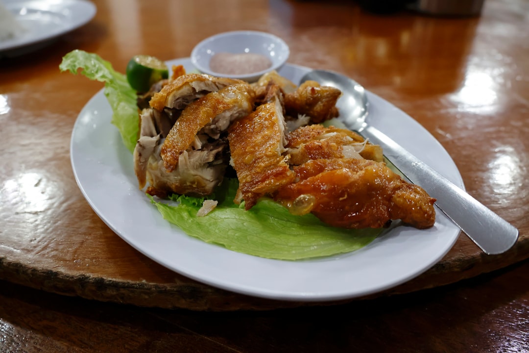 Crispy fried chicken served on lettuce with dipping sauce