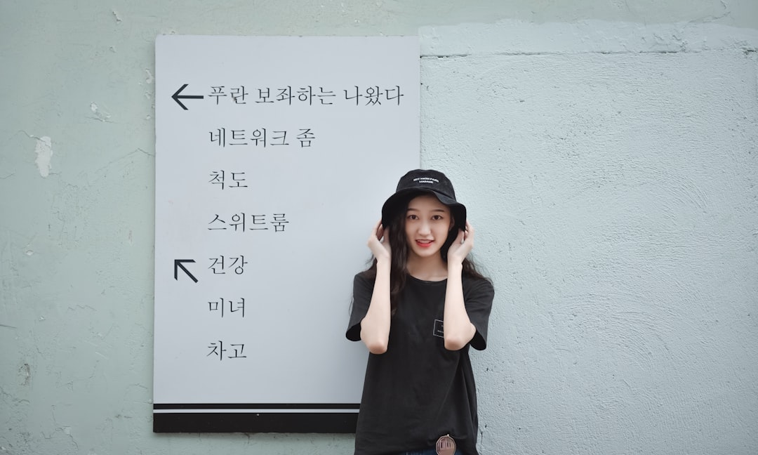 woman in black long sleeve dress wearing black hijab