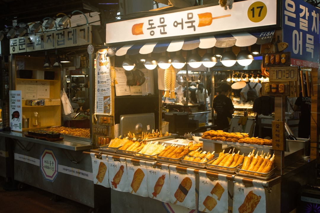 Street food stall with skewers and signs