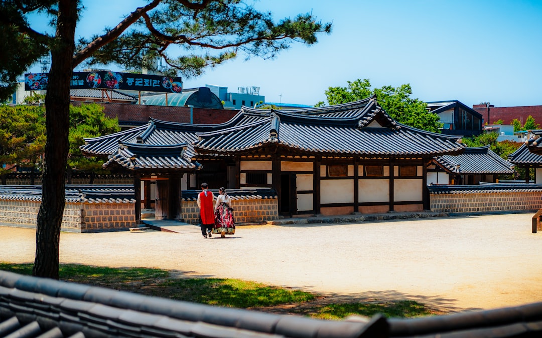 A group of people standing around a building
