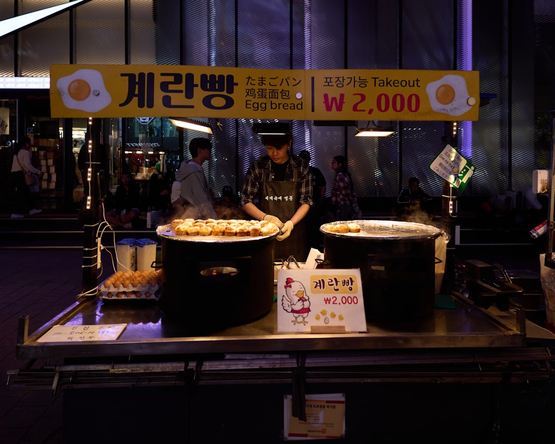a man standing in front of a table filled with food