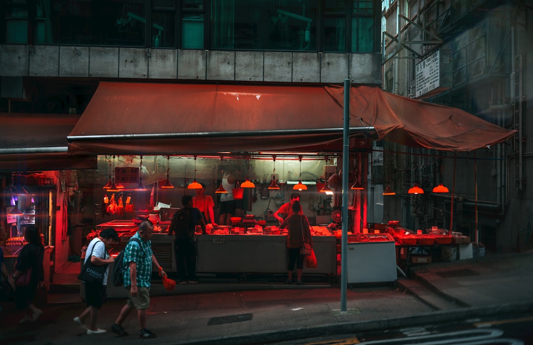 A butcher shop is illuminated with red lights.