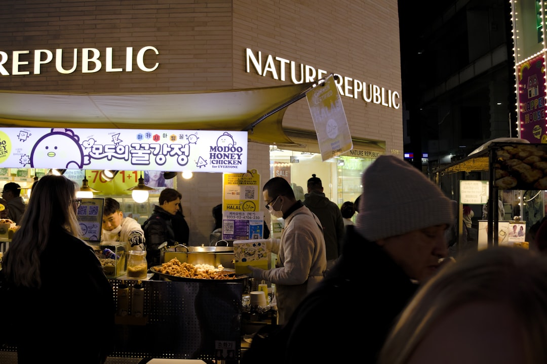 Street food vendors at night near nature republic store