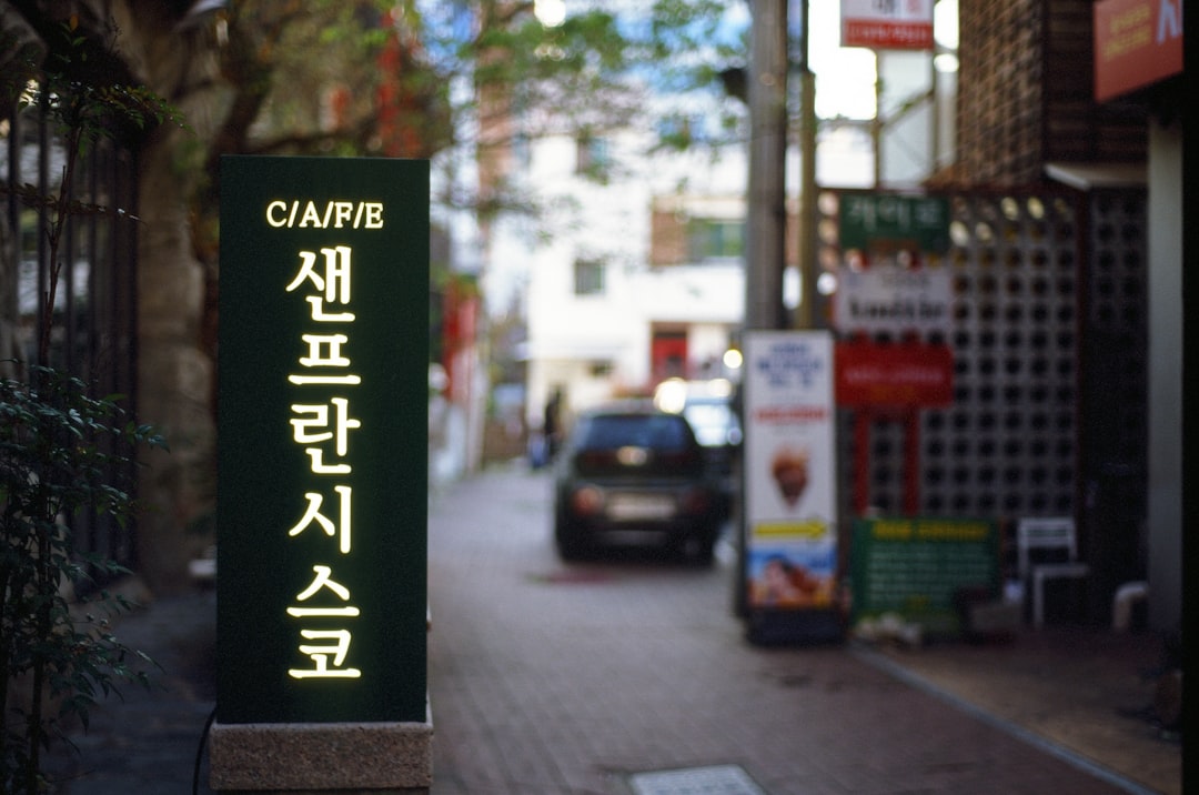 A street scene with a sign in a foreign language.