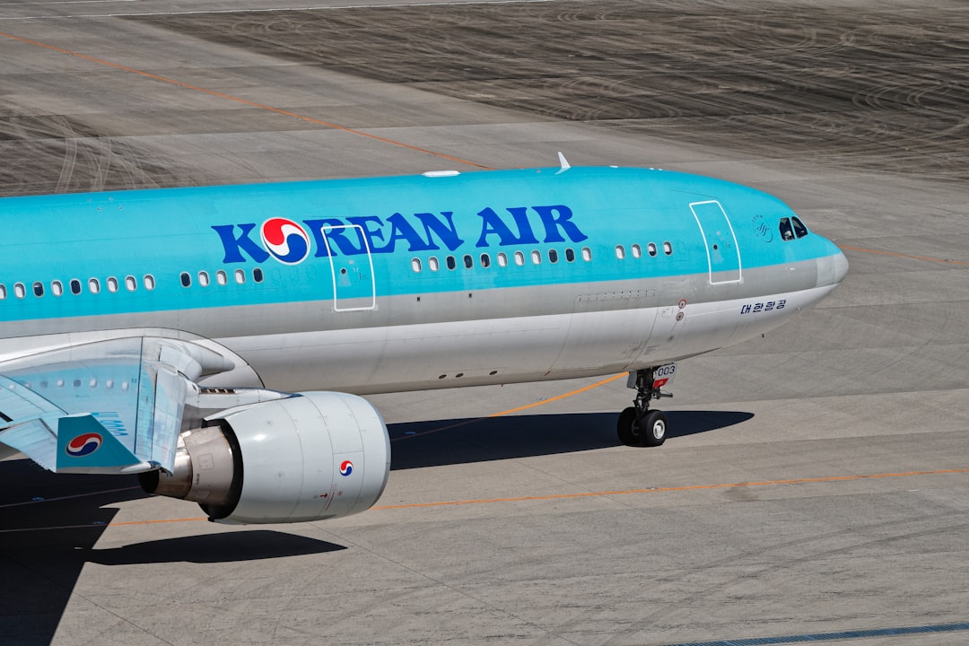 A korean air plane is on the runway