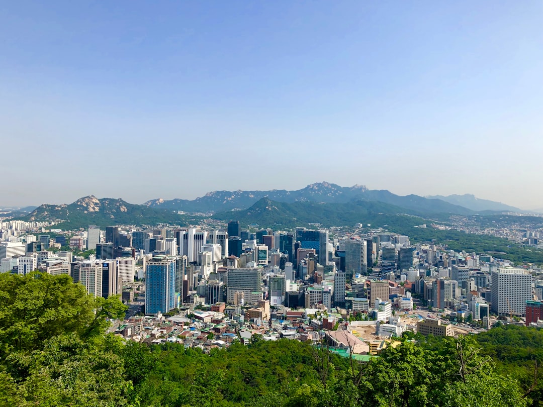 A view of a city with mountains in the background