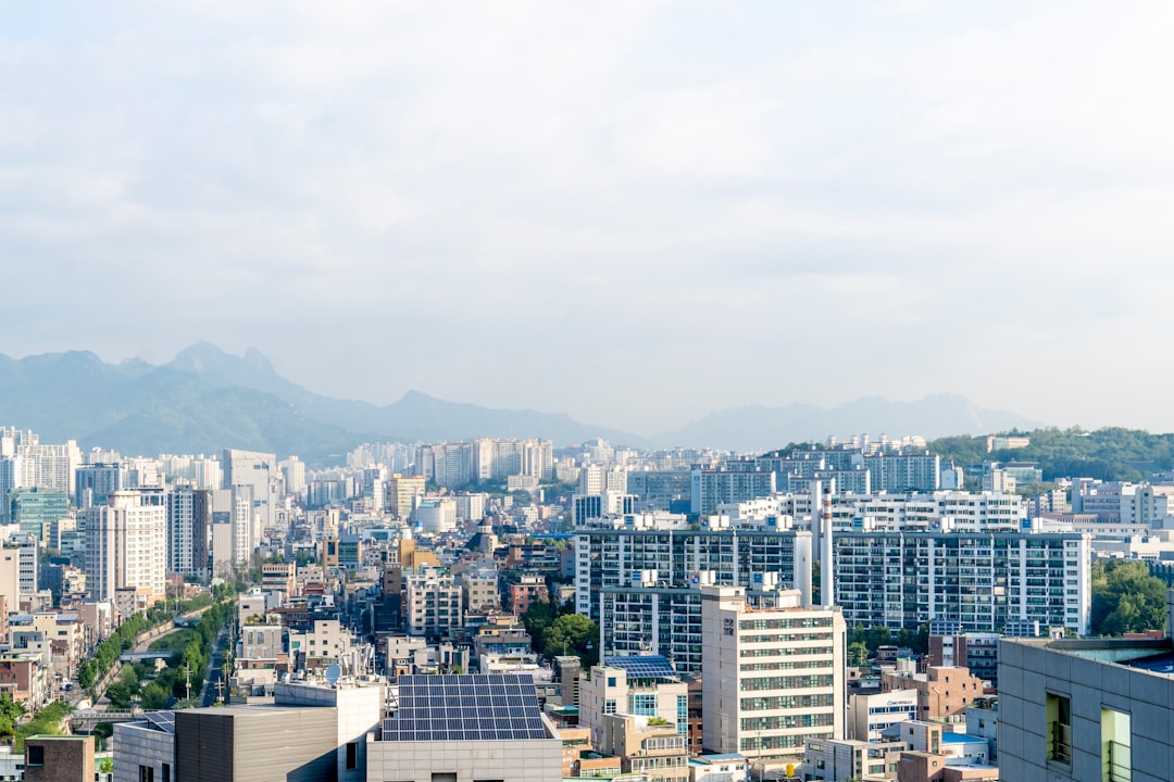 a city with mountains in the background