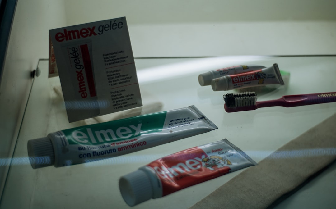 Elmex toothpaste tubes and toothbrushes displayed