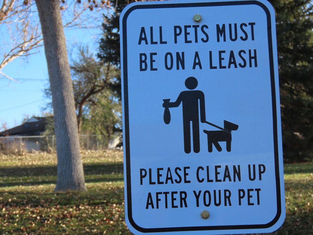 a sign that says all pets must be on a leash please clean up after your