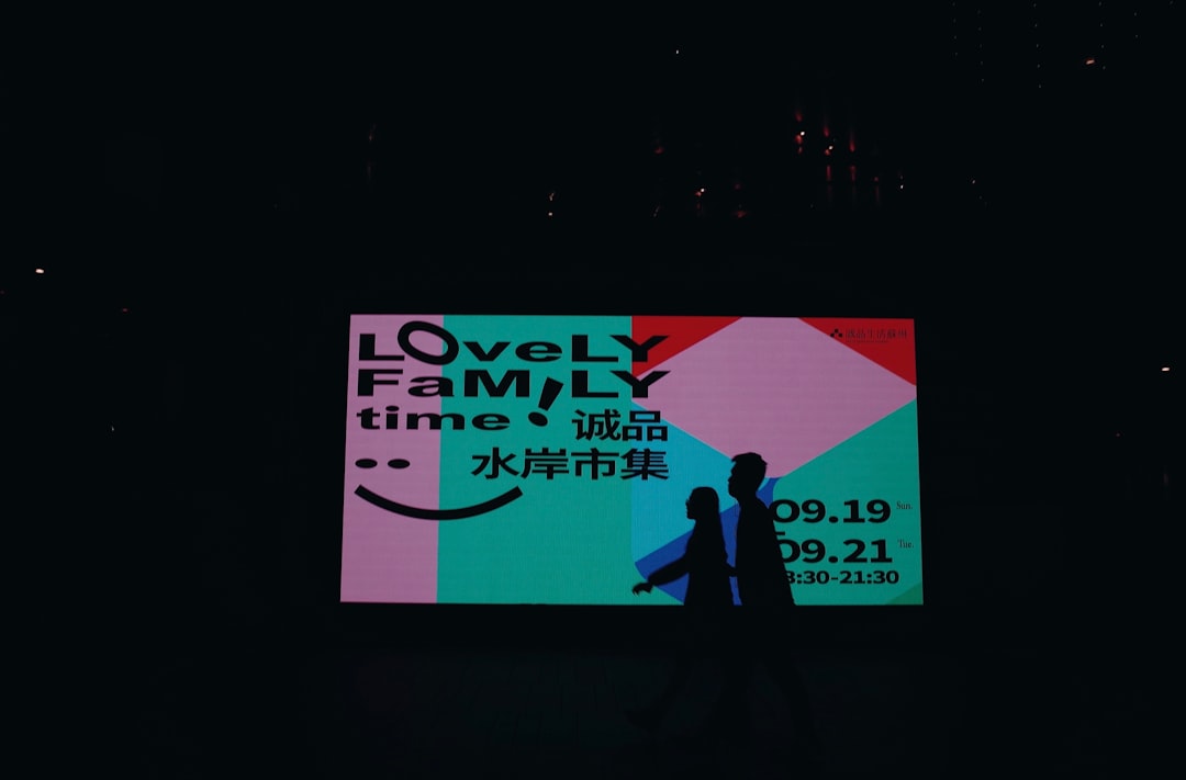 A family event is advertised on a bright screen.