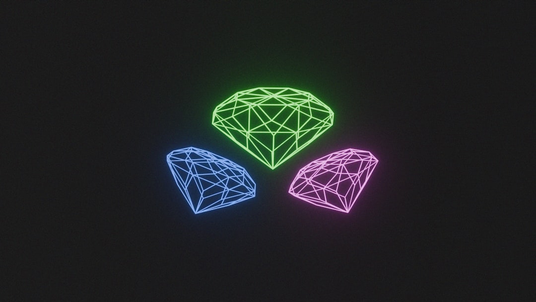 Three different colored diamonds on a black background
