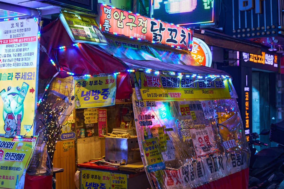 A busy korean street food stall at night.