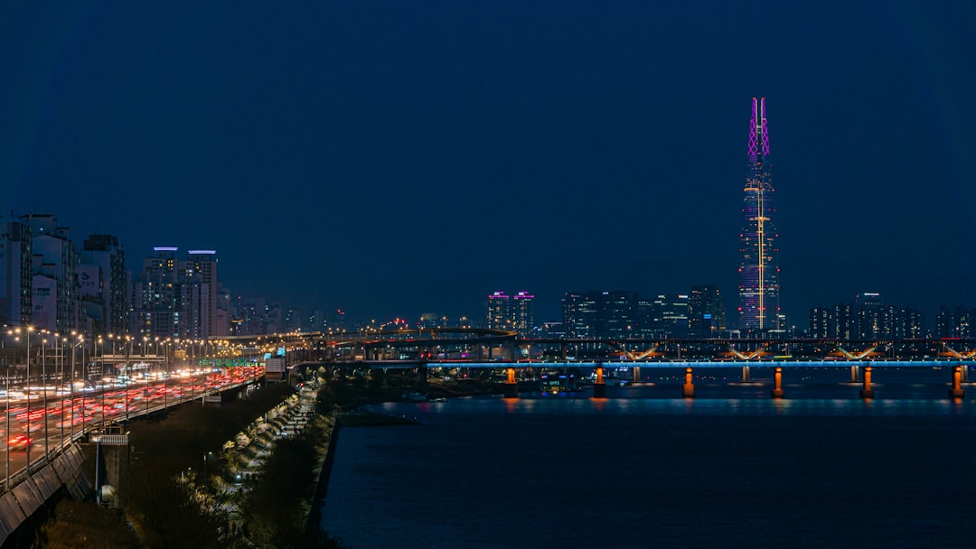 a view of a city at night from a bridge