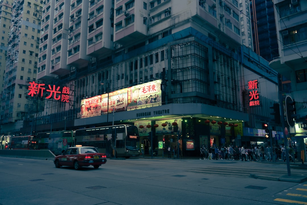 Busy street with neon signs and tall buildings