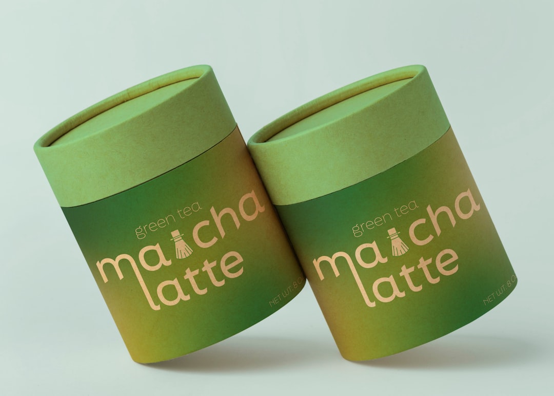 Two green tea matcha latte containers side containers
