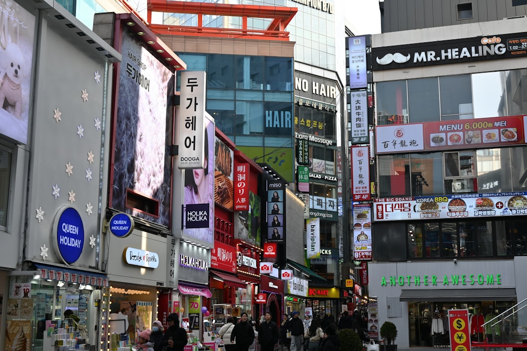 Busy street with shops and signs in a city