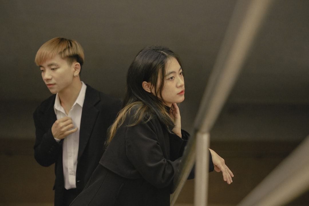 a man and a woman standing next to each other