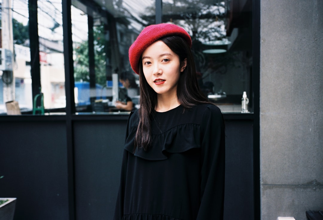 a woman wearing a red hat