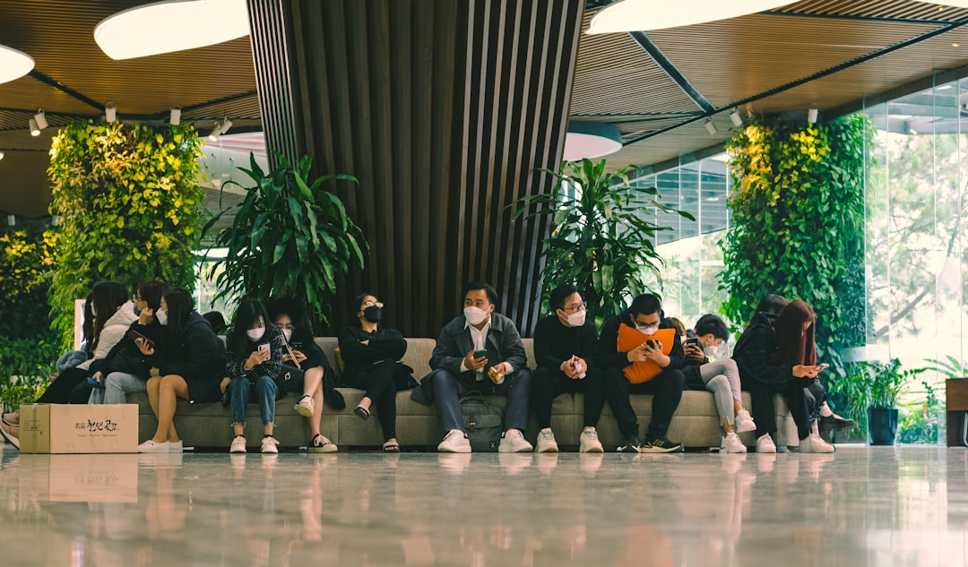 a group of people sitting on top of a couch