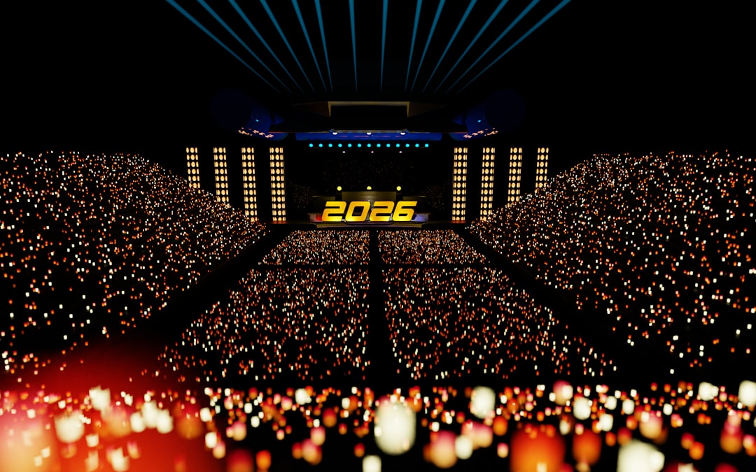Crowded stadium with 2025 displayed on stage.