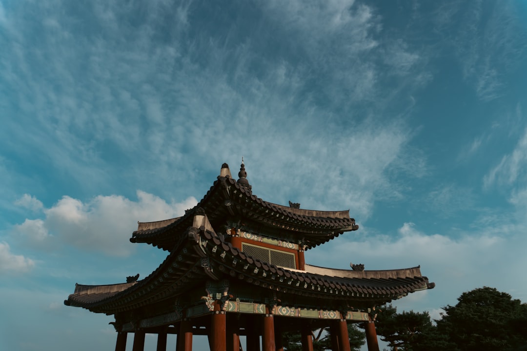 a tall building with a sky background