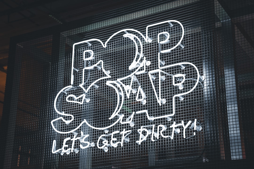 a neon sign that says pop and rap let's get dirty